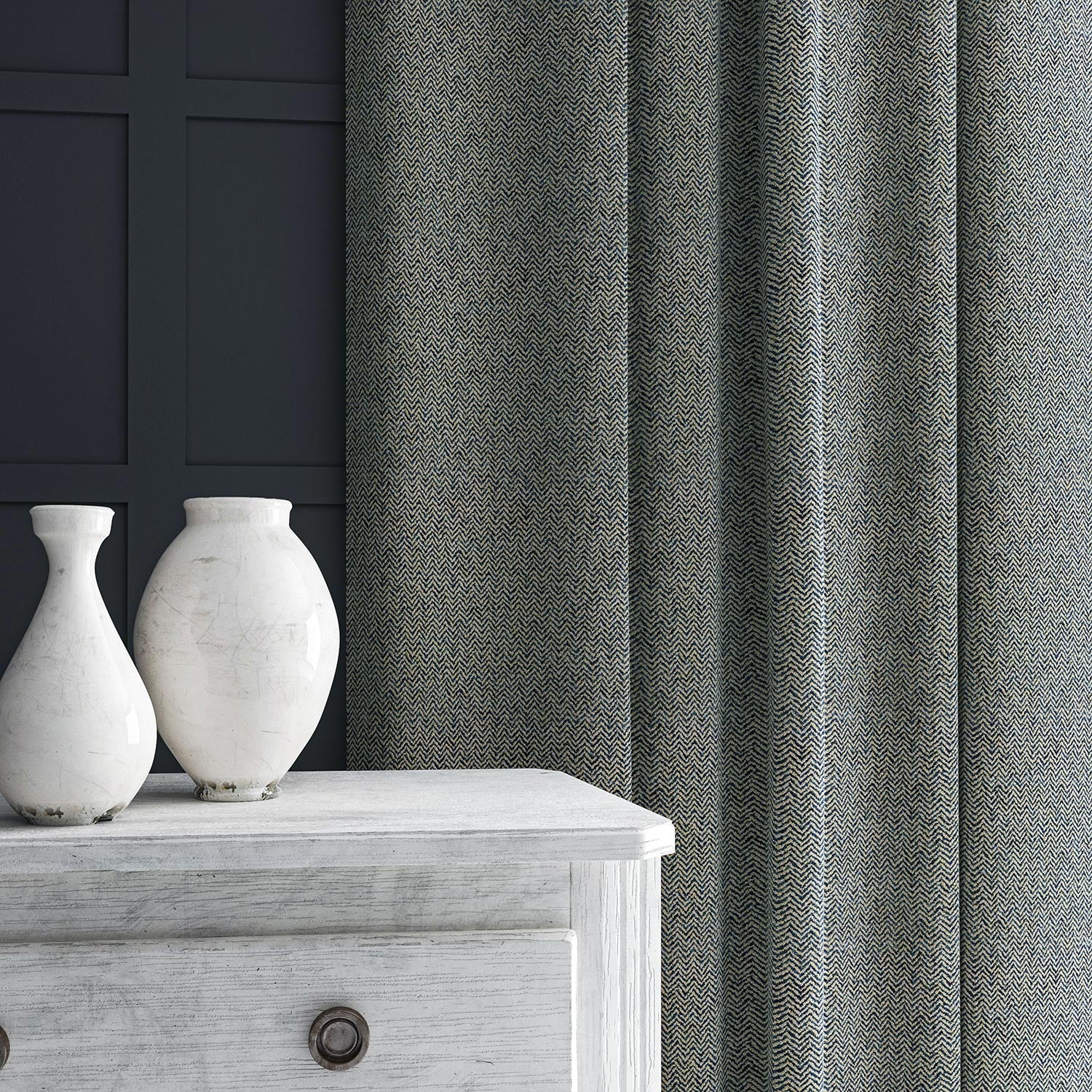 Curtain in blue and off-white woven fabric featuring a herringbone pattern.