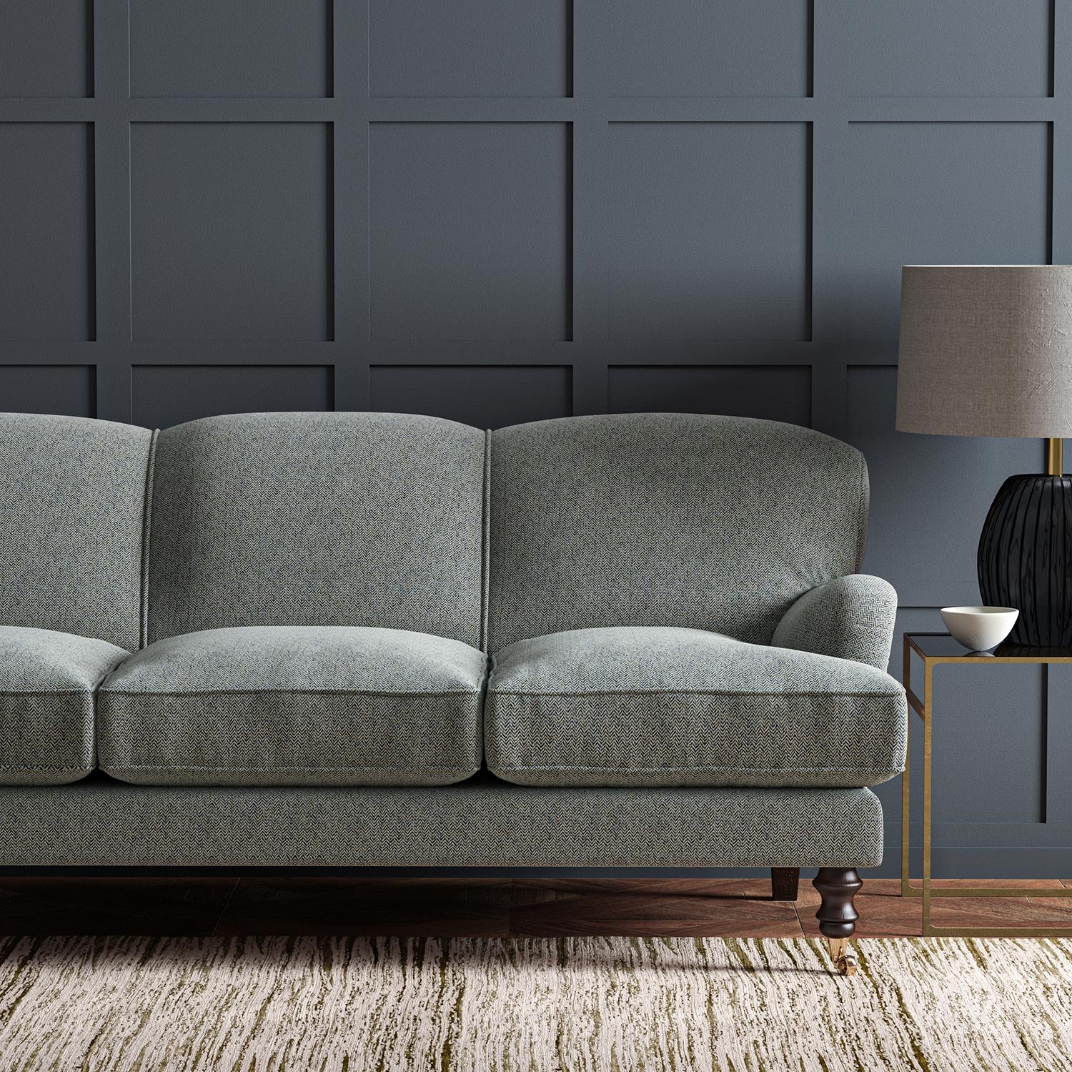 Sofa upholstered in a blue and off-white woven fabric featuring a herringbone pattern.