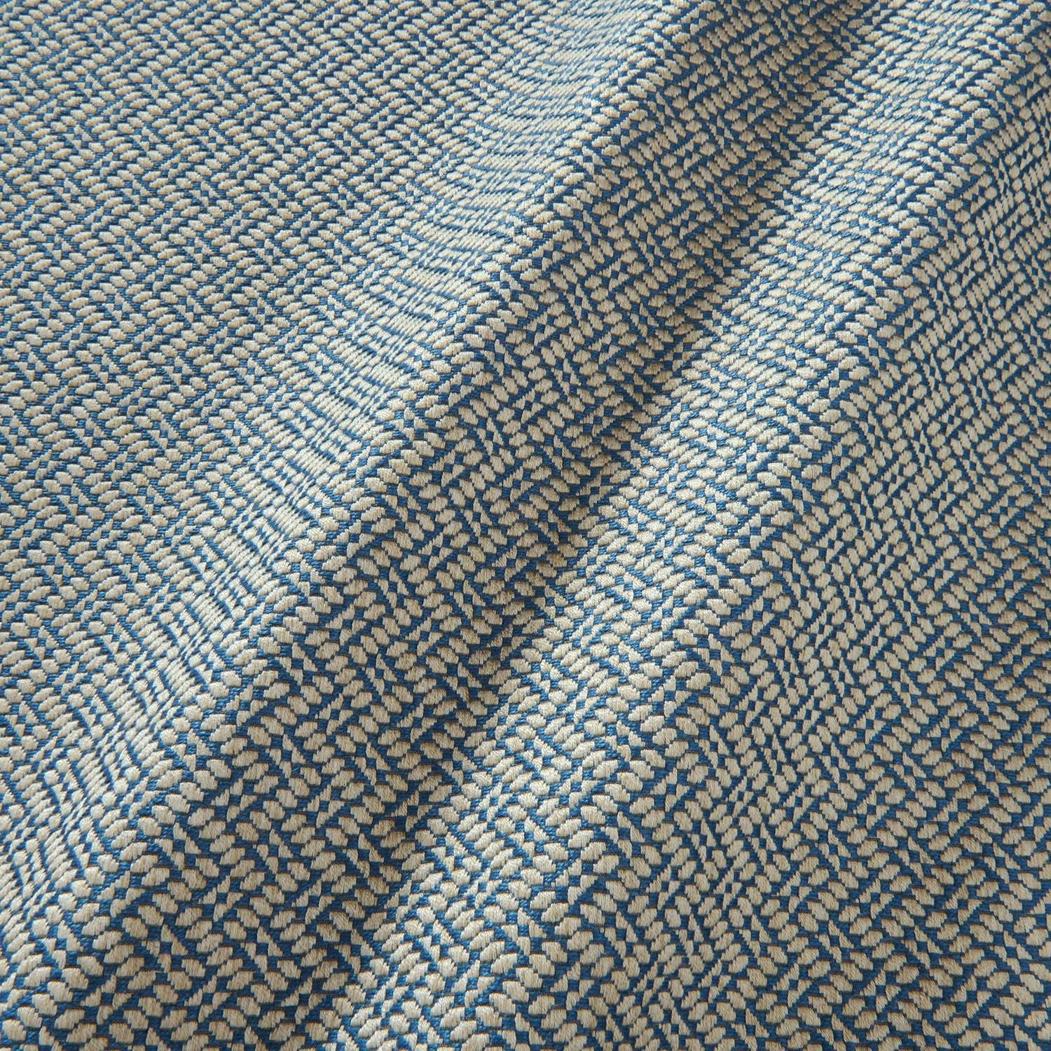 A woven fabric sample in blue and off-white featuring a trellis pattern.
