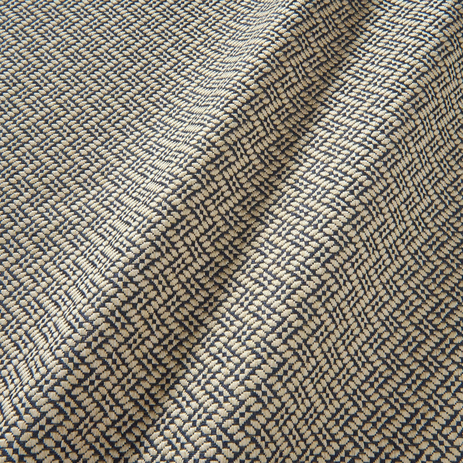 A woven fabric sample in blue and off-white featuring a trellis pattern.