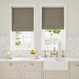 Blinds in blue and off-white woven fabric featuring a trellis pattern.