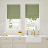 Blinds in green and off-white woven fabric featuring a trellis pattern.
