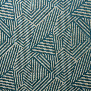 A woven fabric sample in blue and off-white featuring a geometric pattern.