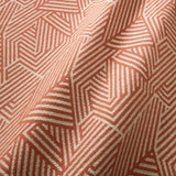 A woven fabric sample in red and off-white featuring a geometric pattern.