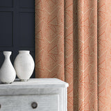 Curtain in red and off-white woven fabric featuring a geometric pattern.