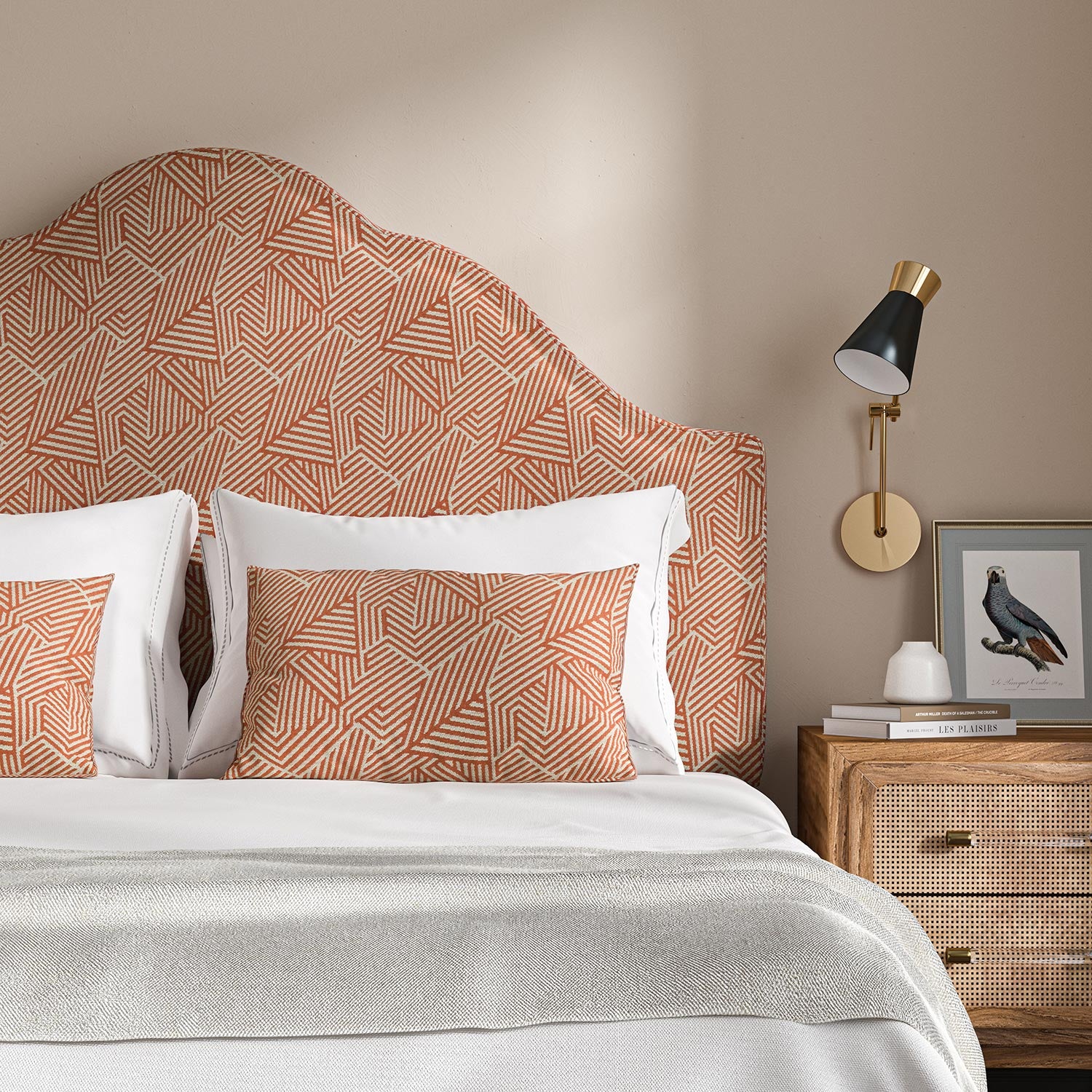 Headboard upholstered in a red and off-white woven fabric featuring a geometric pattern.