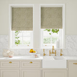 Blinds in beige and off-white woven fabric featuring a geometric pattern.