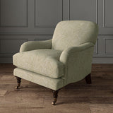 Chair upholstered in a beige and off-white woven fabric featuring a geometric pattern.