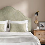 Headboard upholstered in a beige and off-white woven fabric featuring a geometric pattern.