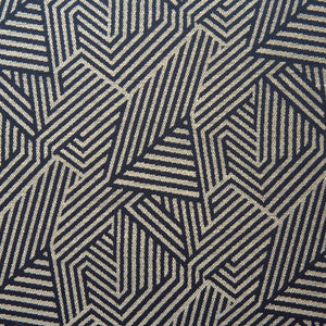 A woven fabric sample in blue and off-white featuring a geometric pattern.