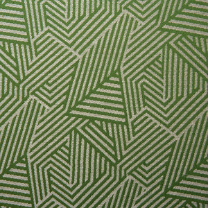 A woven fabric sample in green and off-white featuring a geometric pattern.