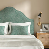 Headboard upholstered in a blue and off-white woven fabric featuring a geometric pattern.