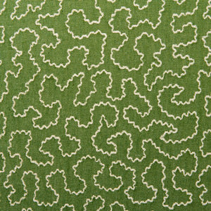 A woven fabric sample in green and off-white featuring a wavy pattern.