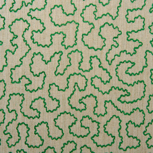 A woven fabric sample in green and off-white featuring a wavy pattern.