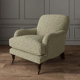 Chair upholstered in a black and beige woven fabric featuring a wavy pattern.
