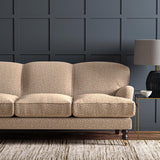 Sofa upholstered in a red and beige woven fabric featuring a wavy pattern.