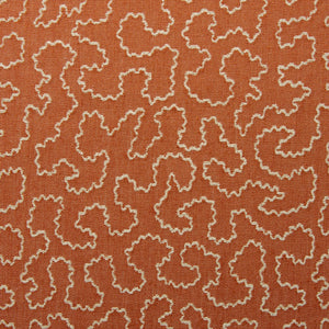 A woven fabric sample in orange and off-white featuring a wavy pattern.