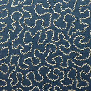 A woven fabric sample in blue and off-white featuring a wavy pattern.