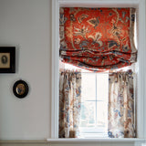 Curtains with a cream fabric with a stylised floral design