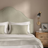 Cream headboard upholstered in a versatile woven fabric.