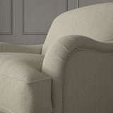 Cream chair upholstered in a versatile woven fabric.