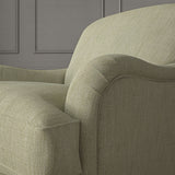 Beige chair upholstered in a versatile woven fabric.