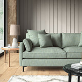 Blue sofa upholstered in a versatile woven fabric.