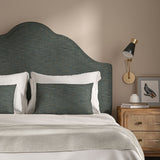 Blue headboard upholstered in a versatile woven fabric.