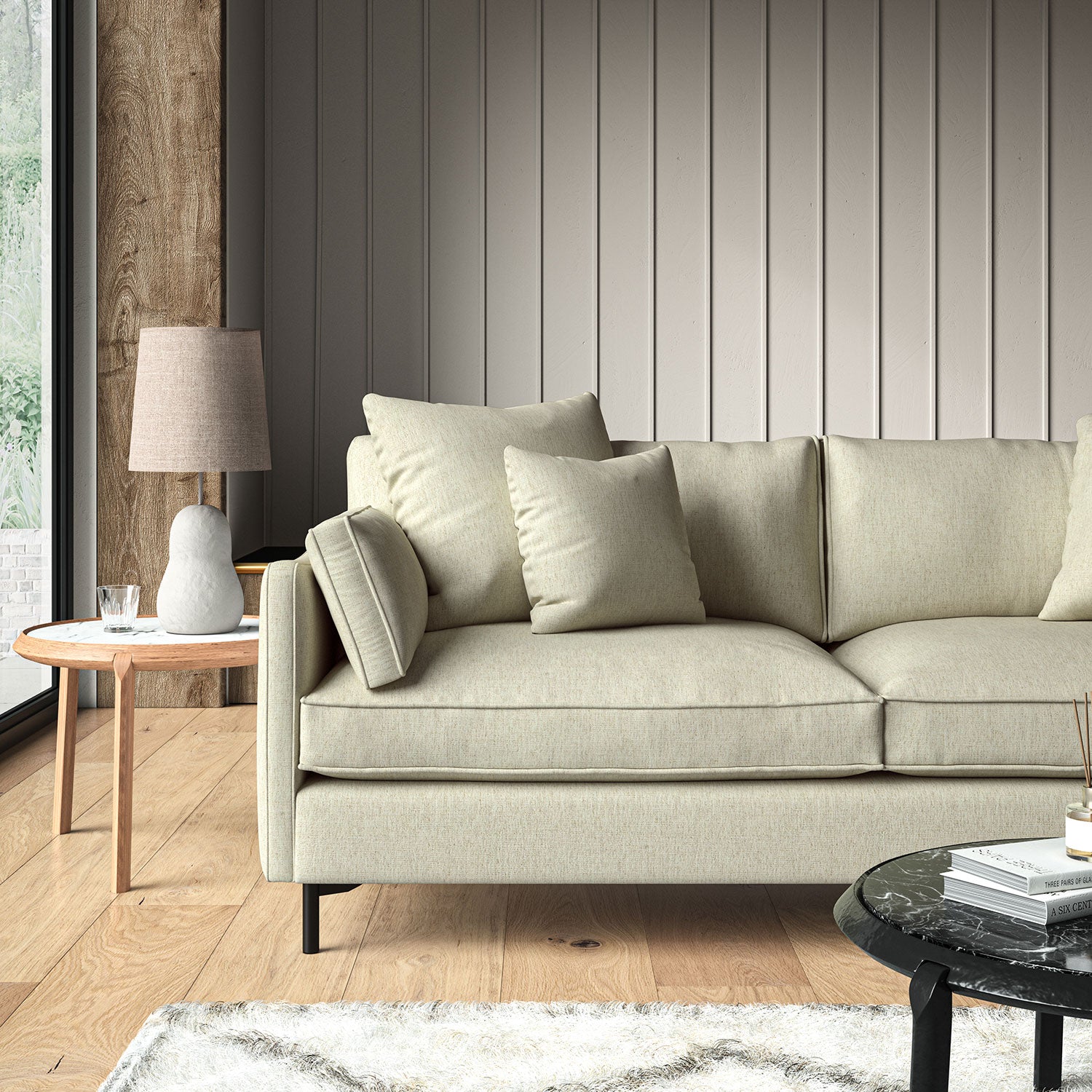 Cream sofa upholstered in a versatile woven fabric.