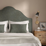 Grey headboard upholstered in a versatile woven fabric.