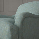 Blue chair upholstered in a versatile woven fabric.