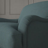 Blue chair upholstered in a versatile woven fabric.