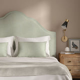 Cream headboard upholstered in a versatile woven fabric.