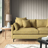 Yellow sofa upholstered in a versatile woven fabric.