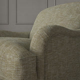 Brown chair upholstered in a versatile woven fabric.