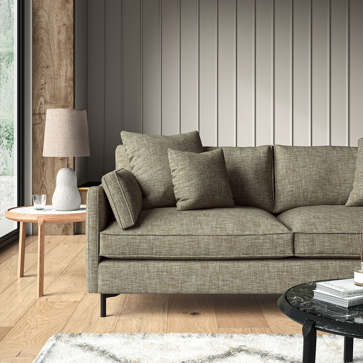 Brown sofa upholstered in a versatile woven fabric.