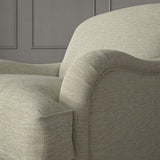 Cream chair upholstered in a versatile woven fabric.