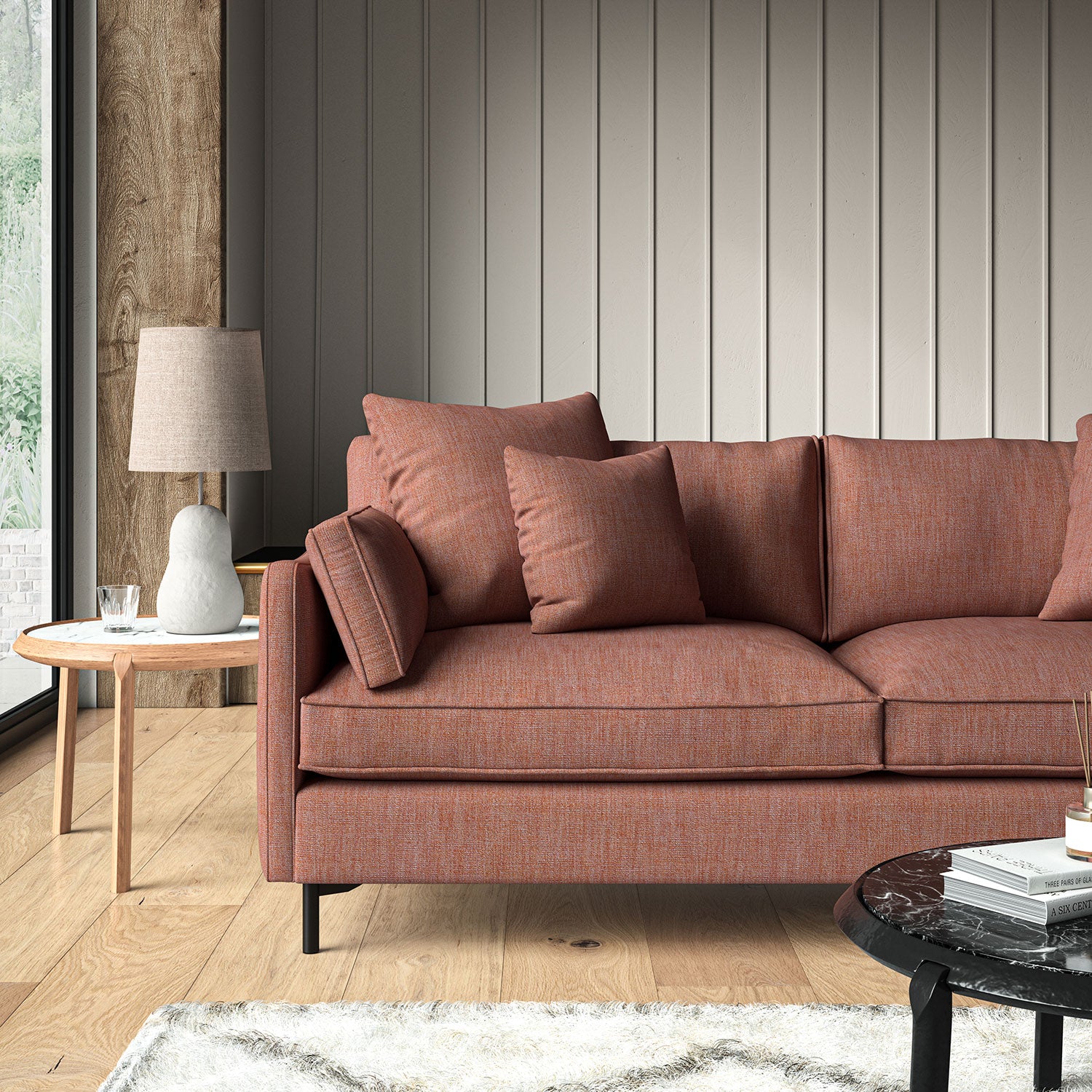 Red sofa upholstered in a versatile woven fabric.