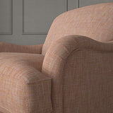 Pink chair upholstered in a versatile woven fabric.