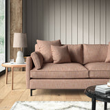 Pink sofa upholstered in a versatile woven fabric.