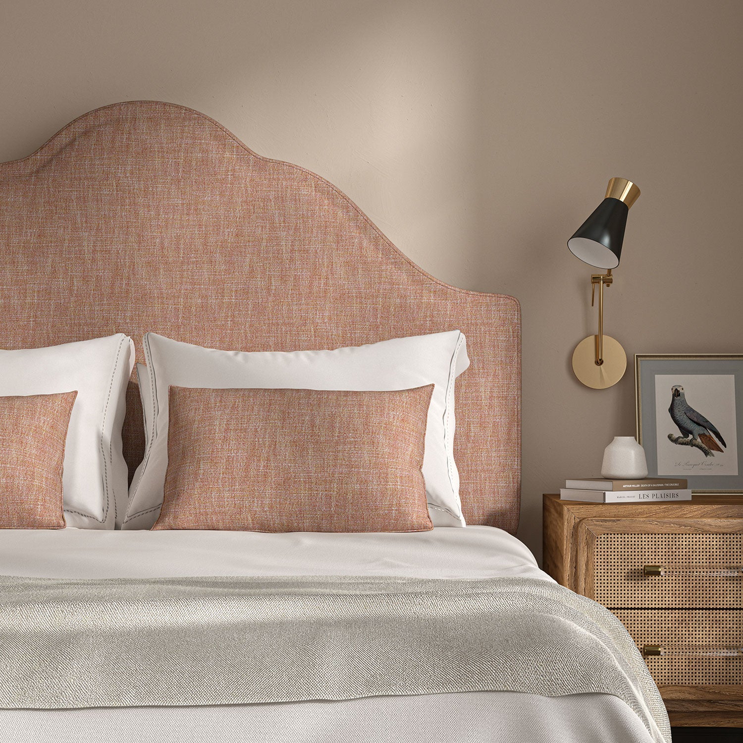 Pink headboard upholstered in a versatile woven fabric.