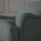 Blue chair upholstered in a versatile woven fabric.