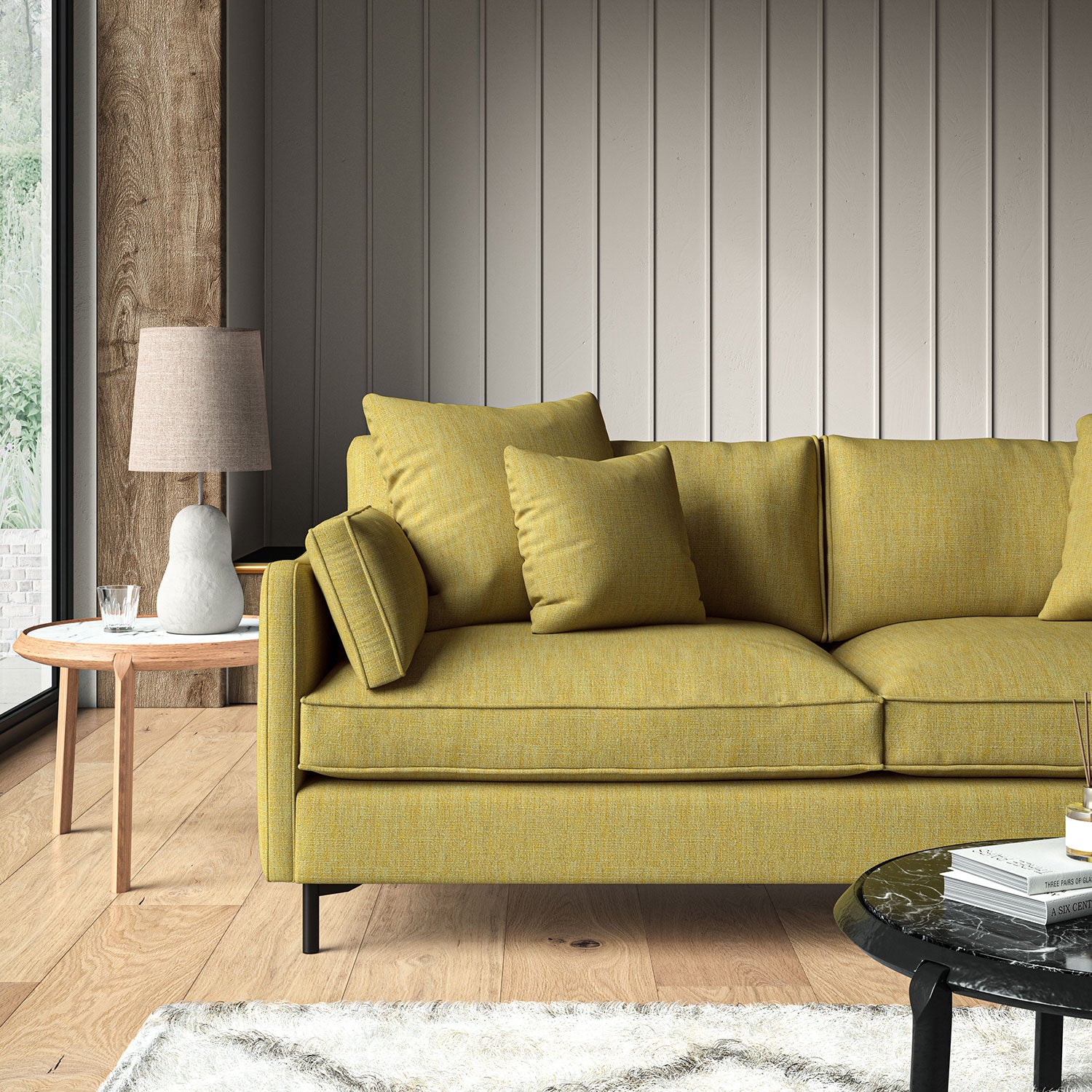 Yellow sofa upholstered in a versatile woven fabric.