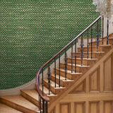 Hall featuring green wallpaper with faux basketweave pattern