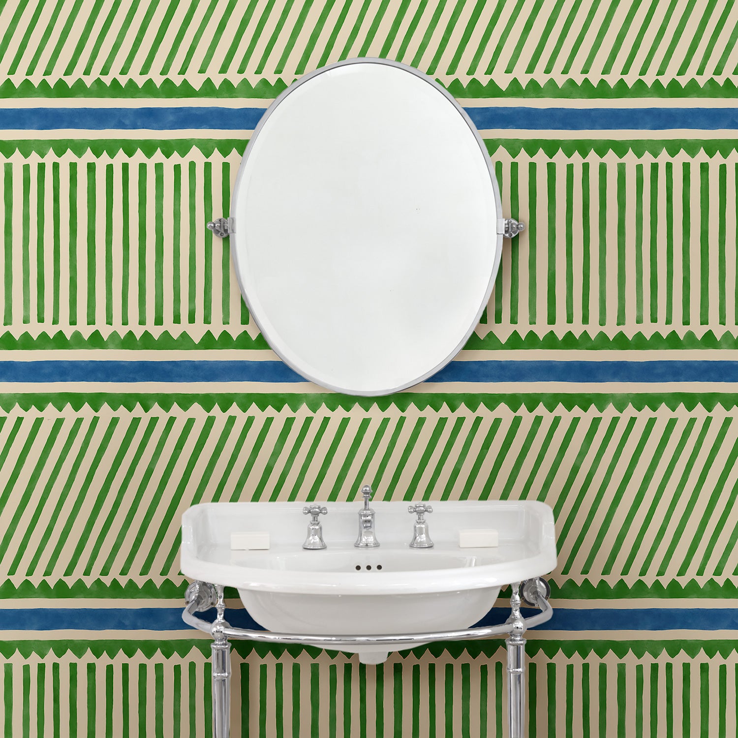 Cloakroom with a playful green and blue wallpaper with a combination of tonal stripes, zigzags, and matching colour bands.