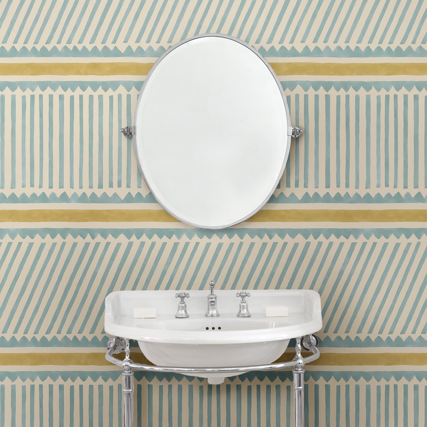 Cloakoom with a blue and yellow wallpaper with a combination of tonal stripes, zigzags, and matching colour bands.