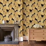 Living room showcasing a contemporary floral wallpaper with tropical palms in gold and black.
