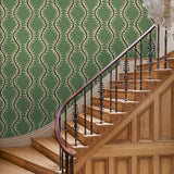 Luxurious wallpaper featuring stylised ferns and wavy lines in green and blue.
