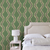Luxurious wallpaper featuring stylised ferns and wavy lines in green and blue.