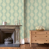 Luxurious wallpaper featuring stylised ferns and wavy lines in blue and cream.